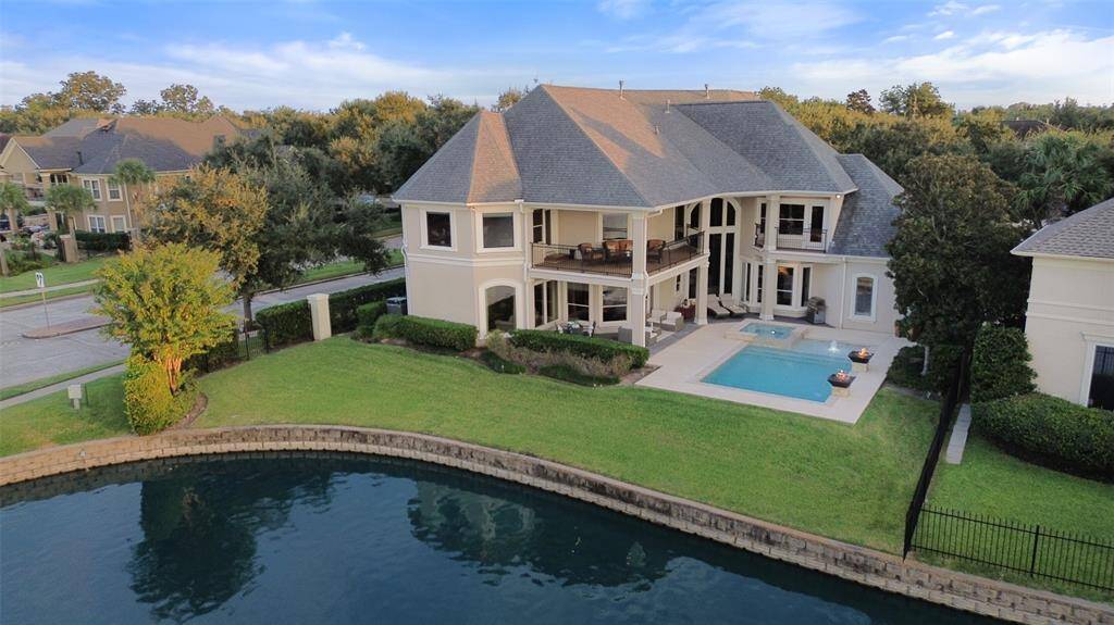 Welcome Home to 60 Waterford Pointe Circle. Your private lakefront paradise in the heart of Sugar Land.