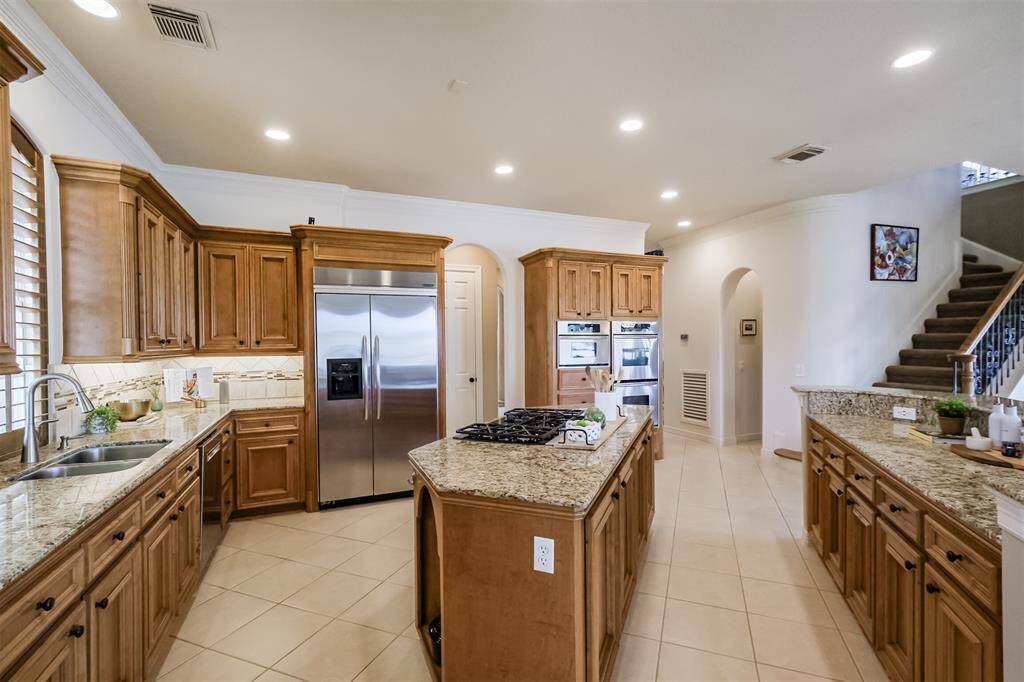 Just TONS of storage and counter space.. To the right of the refrigerator is the door to a large walk in pantry.