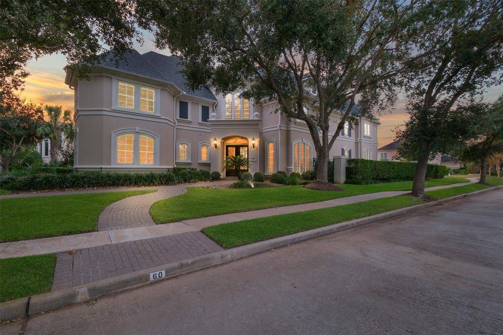This 6 bedroom executive home is situated on a corner, cul de sac, waterfront lot in the prestigious tree lined community of Waters of Avalon.