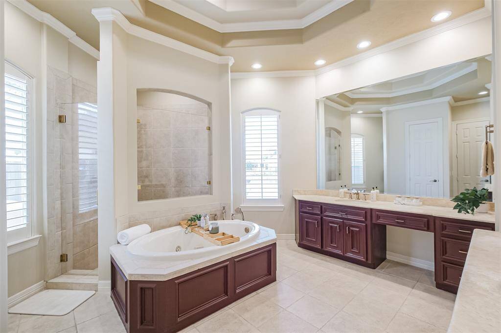 The soothing primary bathroom features soaking tub, separate walk in shower and double vanities.