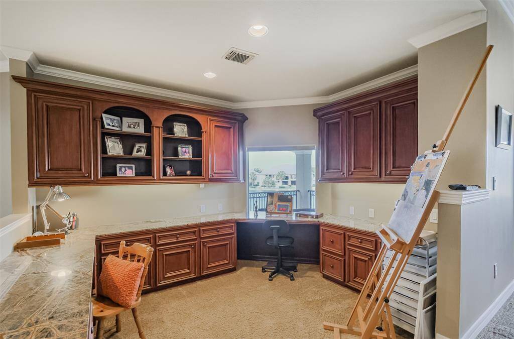At the top of the second staircase is a full work station. Currently being utilized as the owners personal art area, the lighting and views makes this a vesatile addition to the second floor.