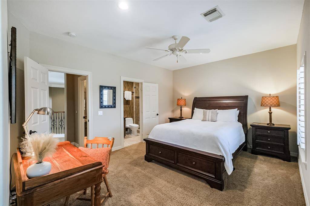 #1 of the 4 secondary bedrooms located upstairs is tucked in from the hallway allowing privacy for family or guests.