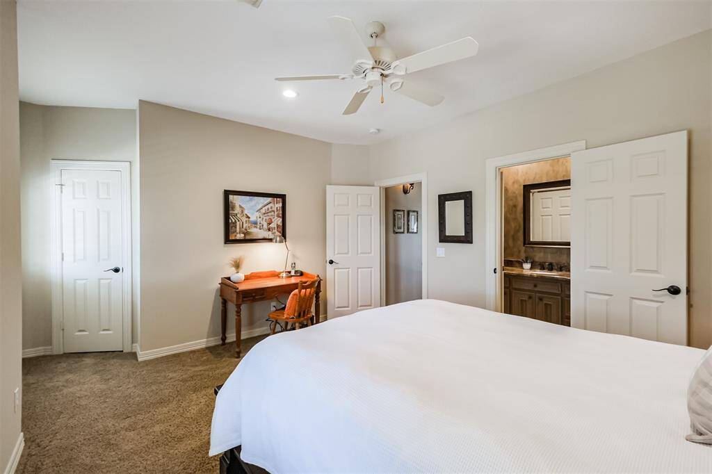 This bedroom has a large walk-in closet, room for a work station and sitting area and en-suite bathroom.