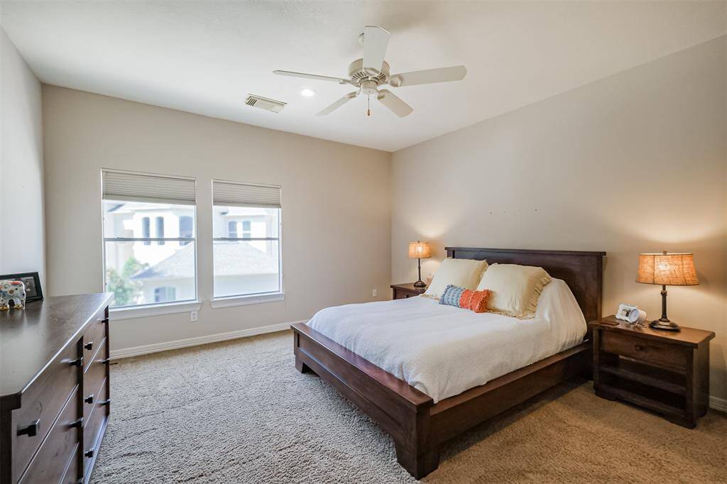 #2 of 4 secondary bedrooms upstairs easily supports a king-sized bed with plently of room to add a dresser and a desk.