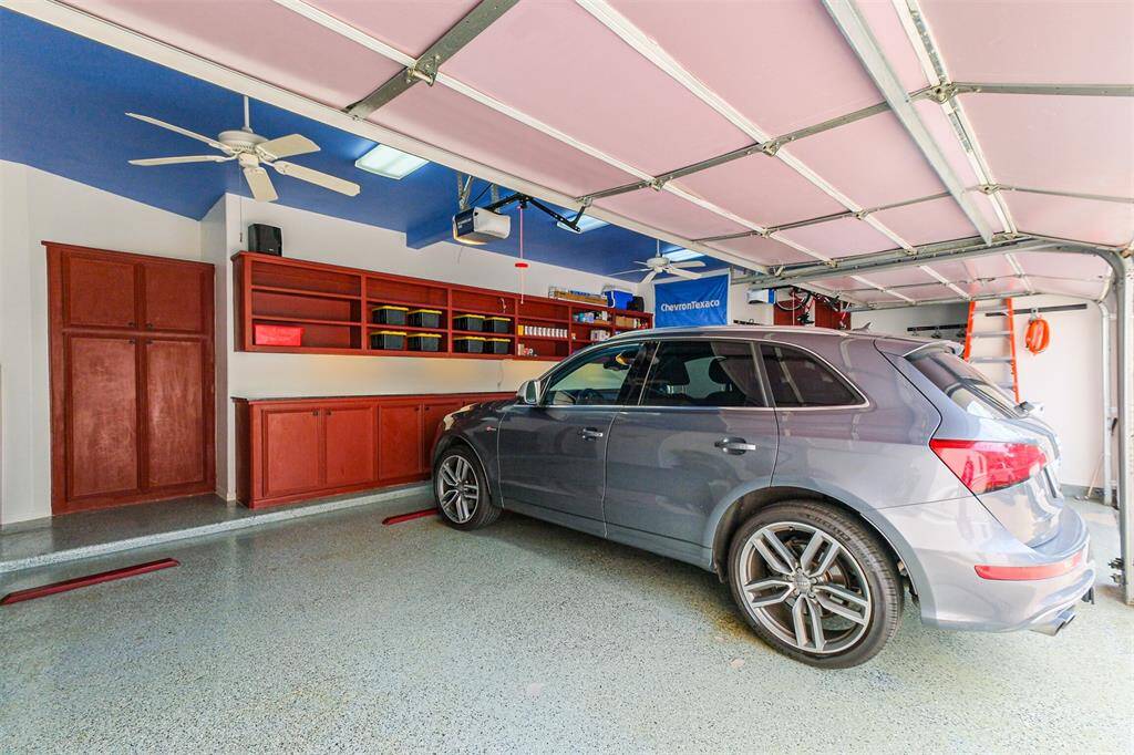 Imaculate and functional 3 car garage with work shop and tons of built ins.