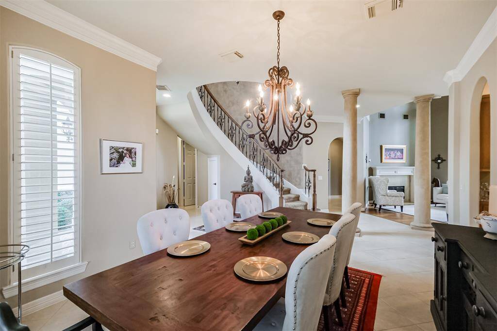 The elegant formal dining room is to the left of the front door and is open to the formal living room. Perfect for entertaining.