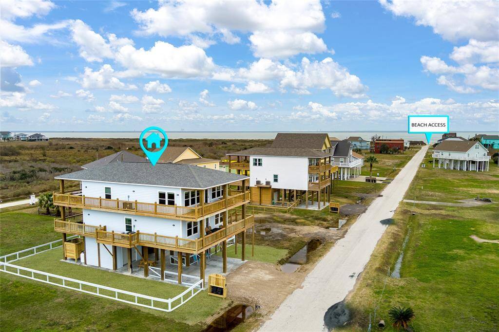 Newly constructed and fully furnished beach house features wrap-around decks with Gulf views to the east and west.