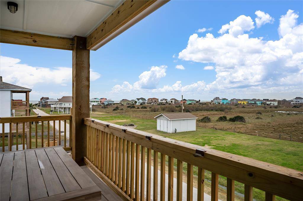 Enjoy the Gulf view down Melody Ln from the front, upper deck.