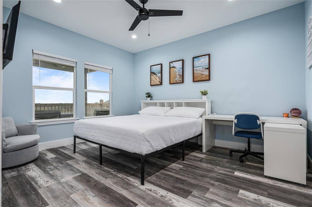 BR 1: The second-floor primary bedroom offers plenty of natural light, ensuite bathroom, and easy access to the back deck.