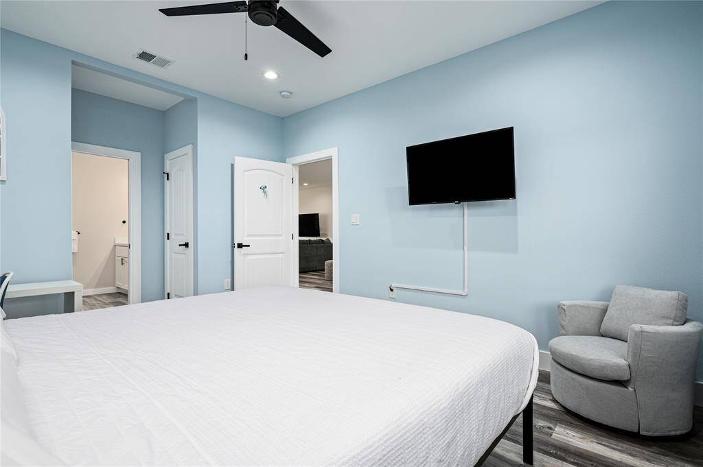 BR 1: The second-floor primary is breezy with its high ceilings and extra space.