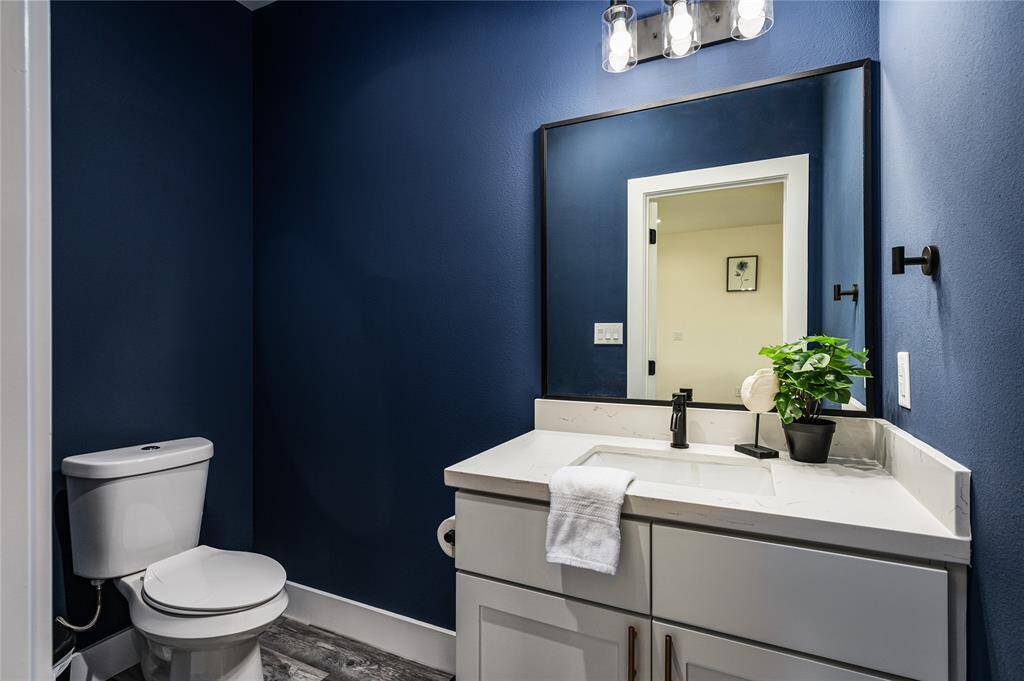 The half bathroom is located just off of the living room on the second floor.