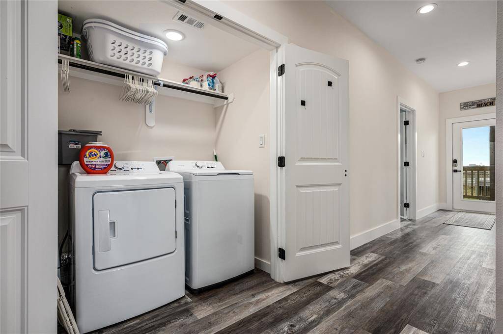 The laundry room is located on the first floor and is equipped with a full-size washer and dryer.