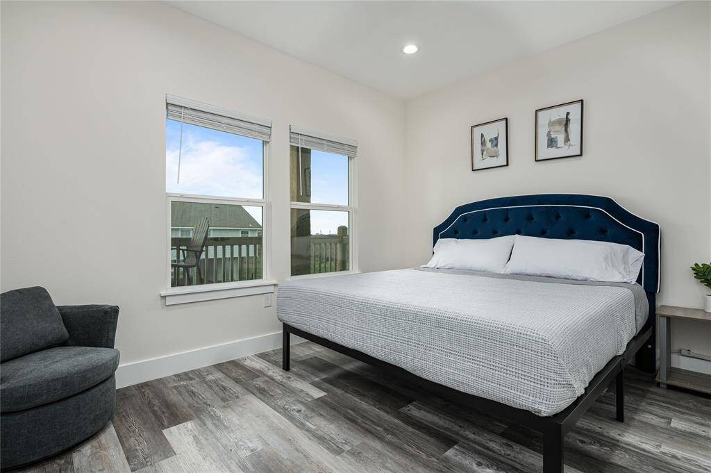 BR 5: Private king bedroom offers views, an ensuite bathroom, and easy access to the front deck.