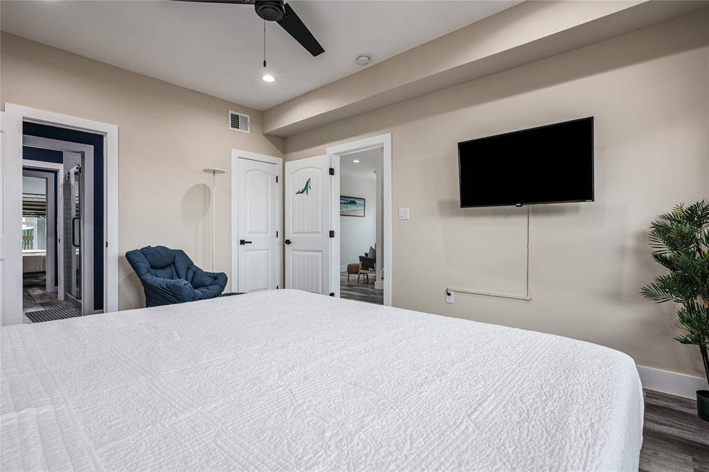 BR 4: This spacious bedroom has a ceiling fan and LVP flooring.