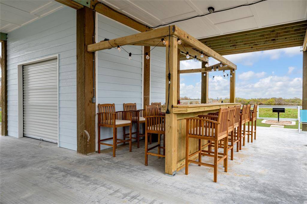 The tiki bar is strung with lights and is ready for a crowd!