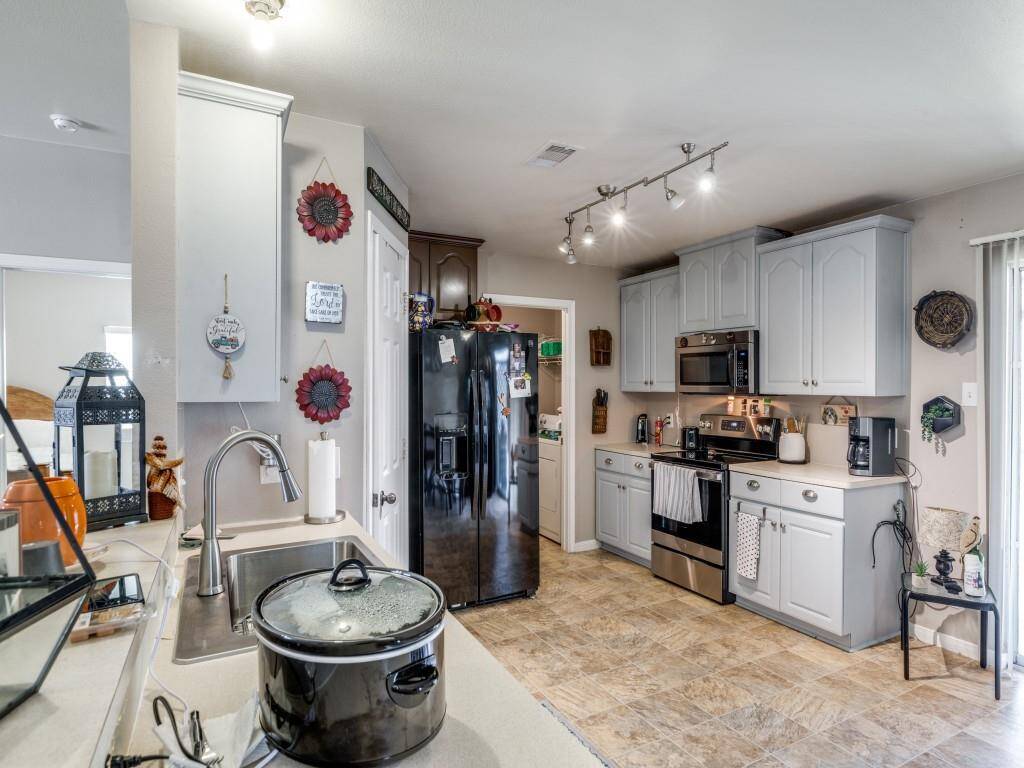 "The kitchen has ample counterspace and cabinets."