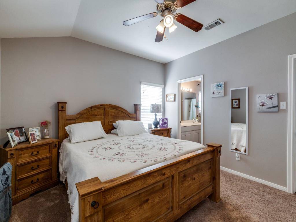 "The master bedroom is quite spacious and features a door that leads to the master bathroom."