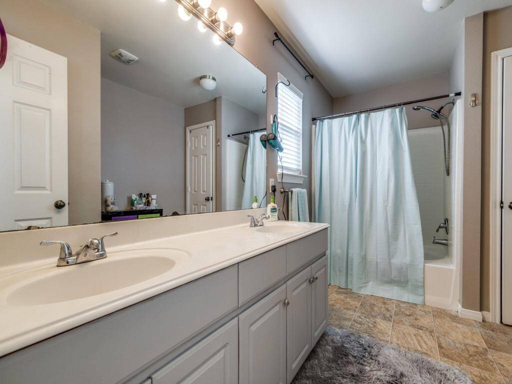 "The master bathroom has two separate vanities."
