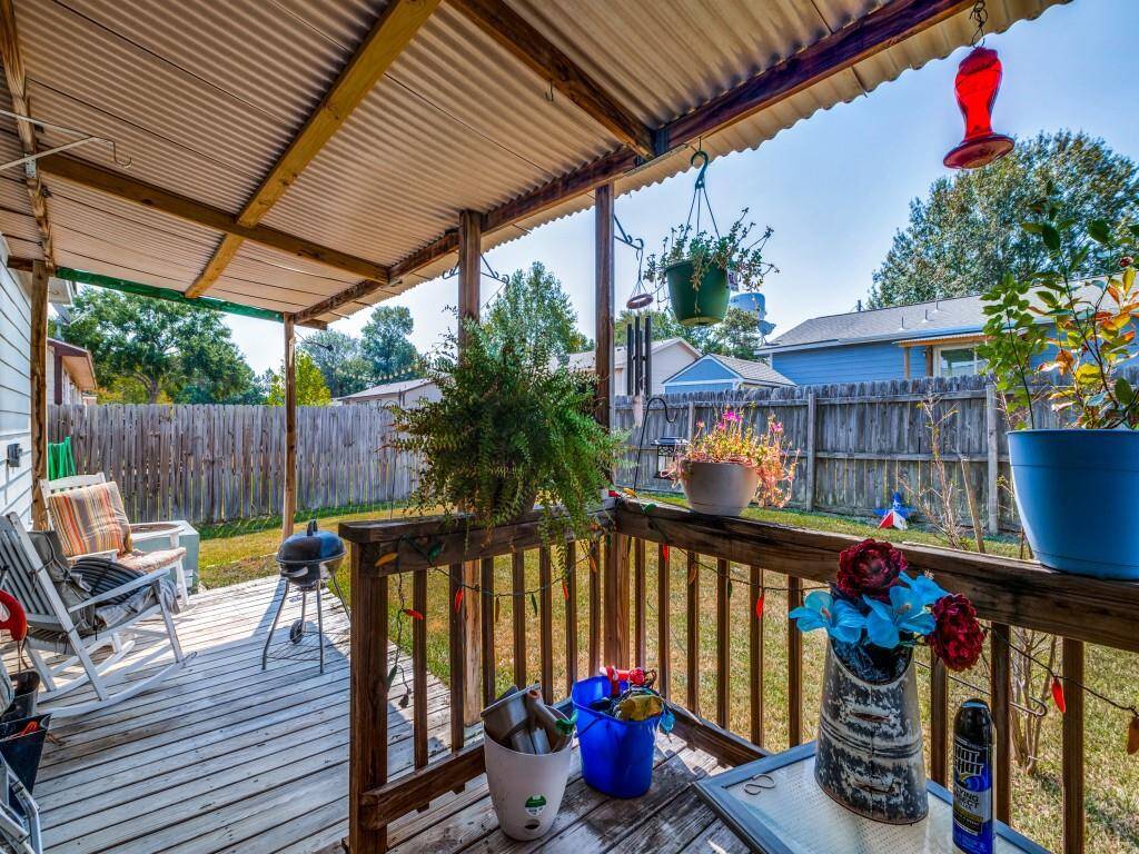 A back patio with a cover is available to enjoy the backyard.
