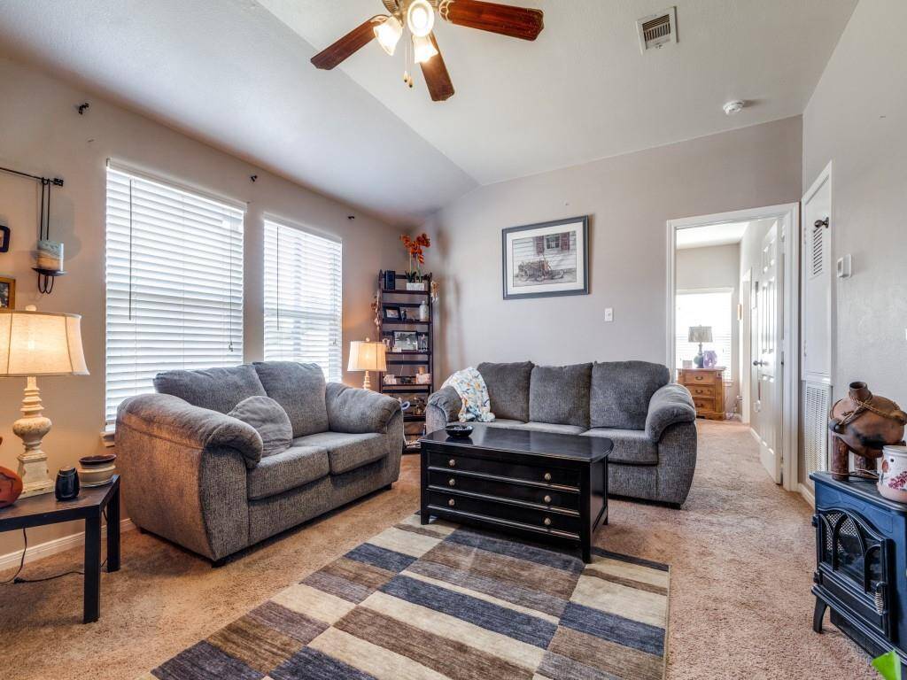 "The living room is located at the front of the house, while the master bedroom is situated at the rear."