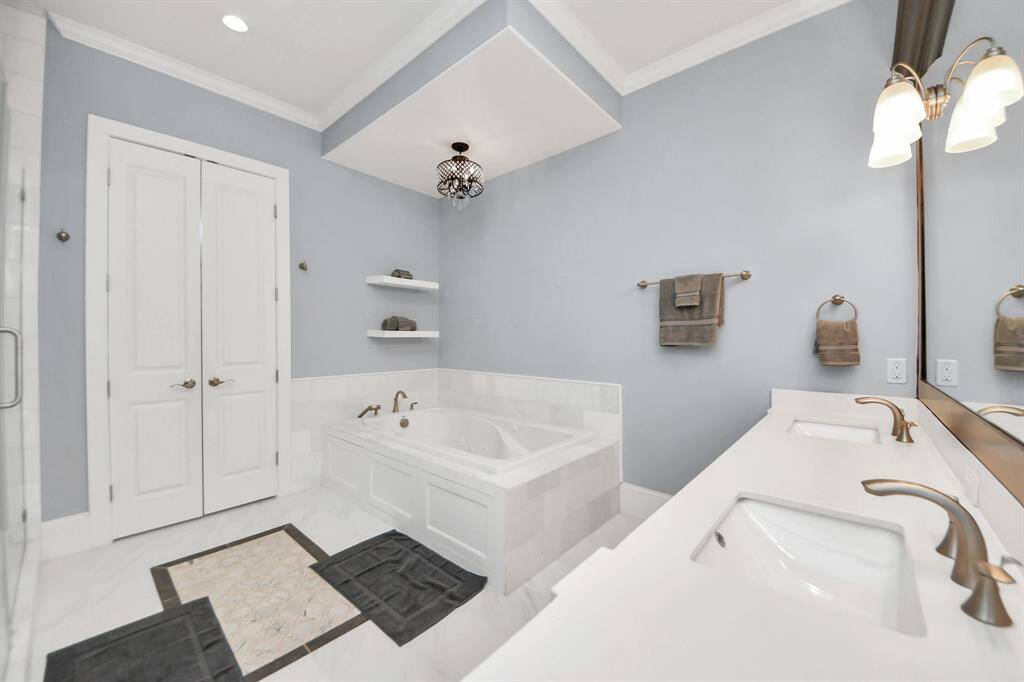 Escape to a spa-like oasis in this primary bathroom.