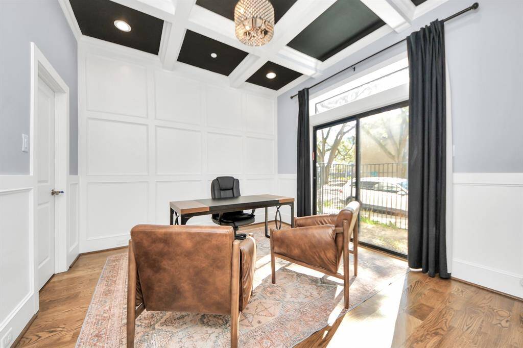 Experience the perfect blend of sophistication and warmth in this 1st floor guest suite bedroom, currently being used as home office. It boast elegant engineered wood flooring and flooded with natural light from expansive windows .