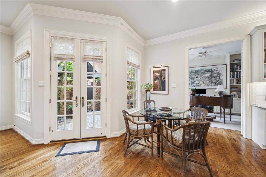 Breakfast nook in the corner of the kitchen with French doors leading out to back patio