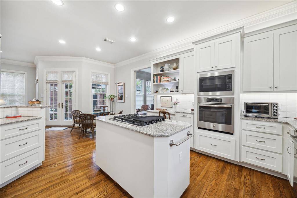 The kitchen has a nice built-in desk next to the oven