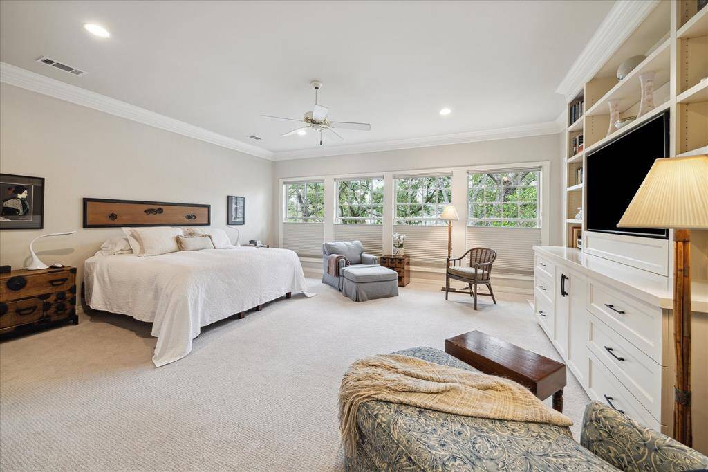 Large primary retreat with built-in drawers and shelves