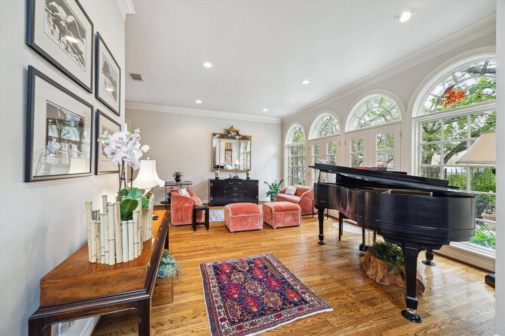 Formal living room with enough space for a piano and seating area