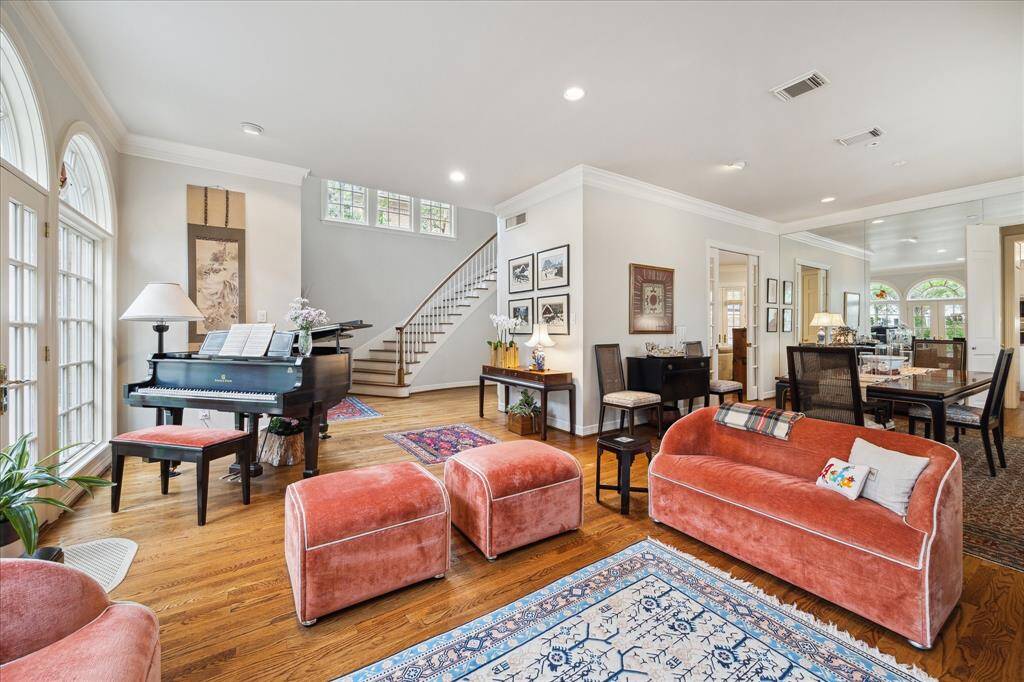 The large formal living room is off of the foyer with views of the dining room