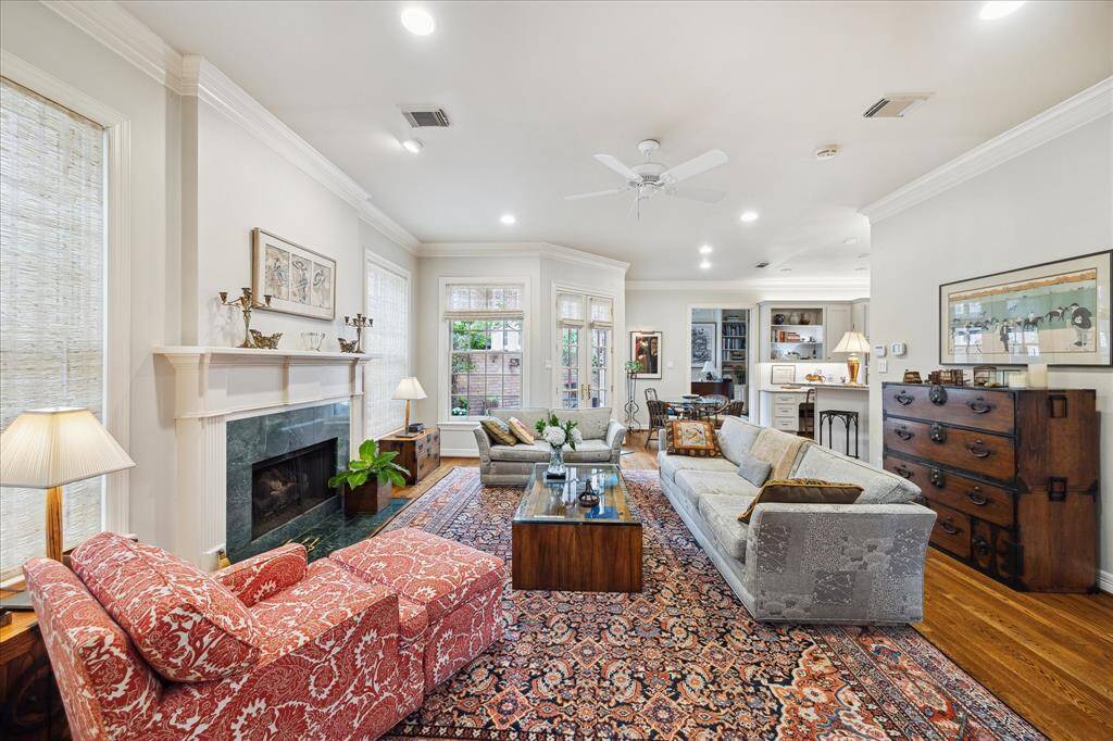 Cozy den with fireplace and views of the back patio