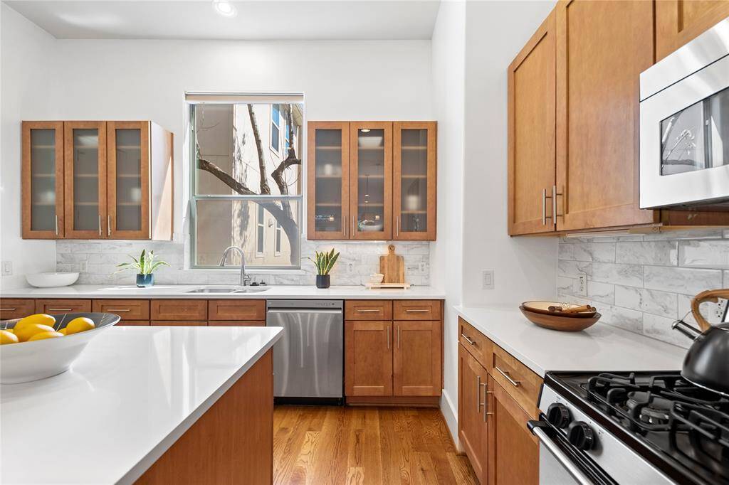 The kitchen island adds prep space, a serving area, and additional cabinets for storage.