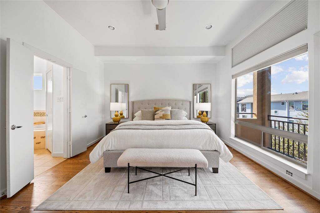 A king size bed, with two side tables and seating fit comfortably in the primary bedroom that measures 17' x 13'.