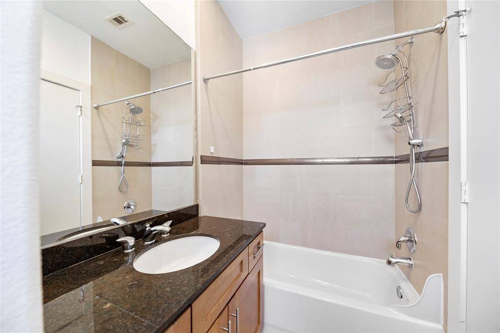 Full bath adjoins secondary, 3rd floor bedroom.