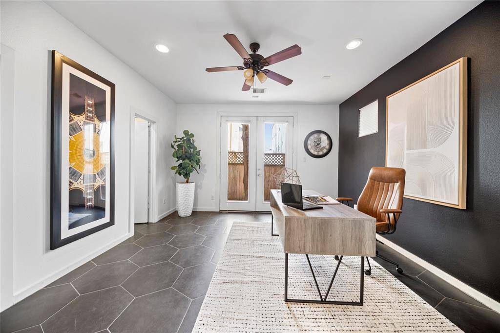 The first floor bedroom could be used as a home office or guest room. Double doors lead to the backyard. The room has an en-suite bath and walk-in closet.