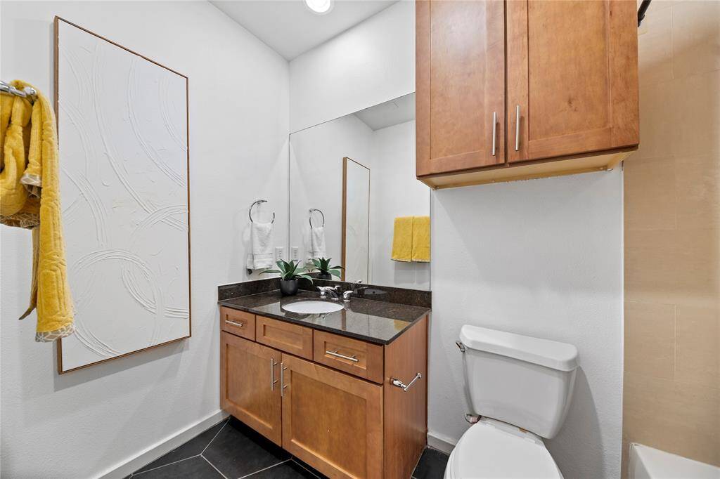 The first floor bedroom has an adjoining full bathroom with a shower/tub combo.