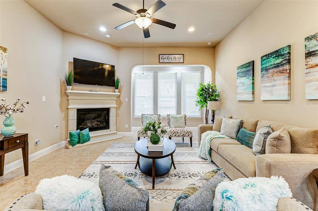 Elegant stone fireplace decorates this living area