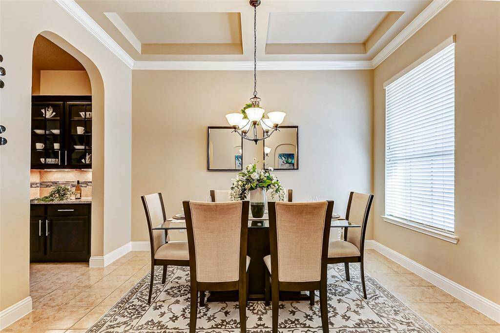 Dining communicates with the kitchen complemented by a butler pantry