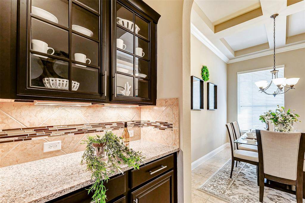 Nice butler pantry with glass door cabinets