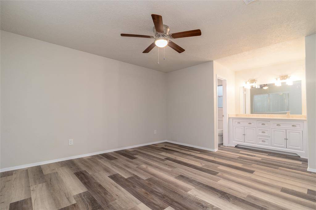 Main Bedroom has a large bathroom vanity in the bedroom.