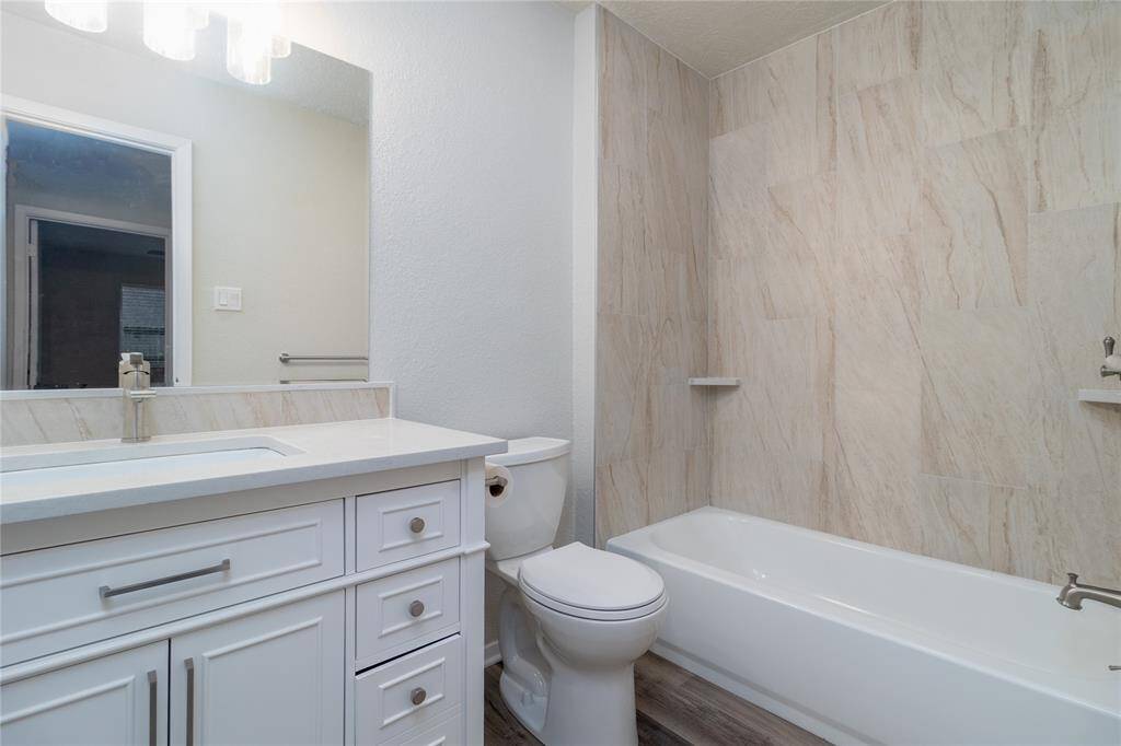 Hall Bathroom has been updated with a new vanity, granite counter top, new tub and shower combo.