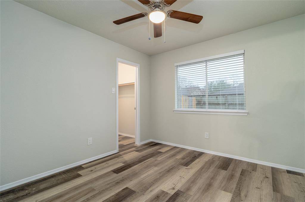 3rd Bedroom has a new ceiling fan, wood flooring and new 2 inch wood blinds. .