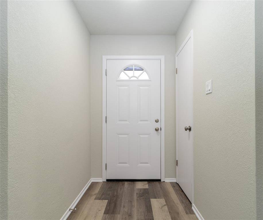 New front door, new wood flooring and complete house has been painted.