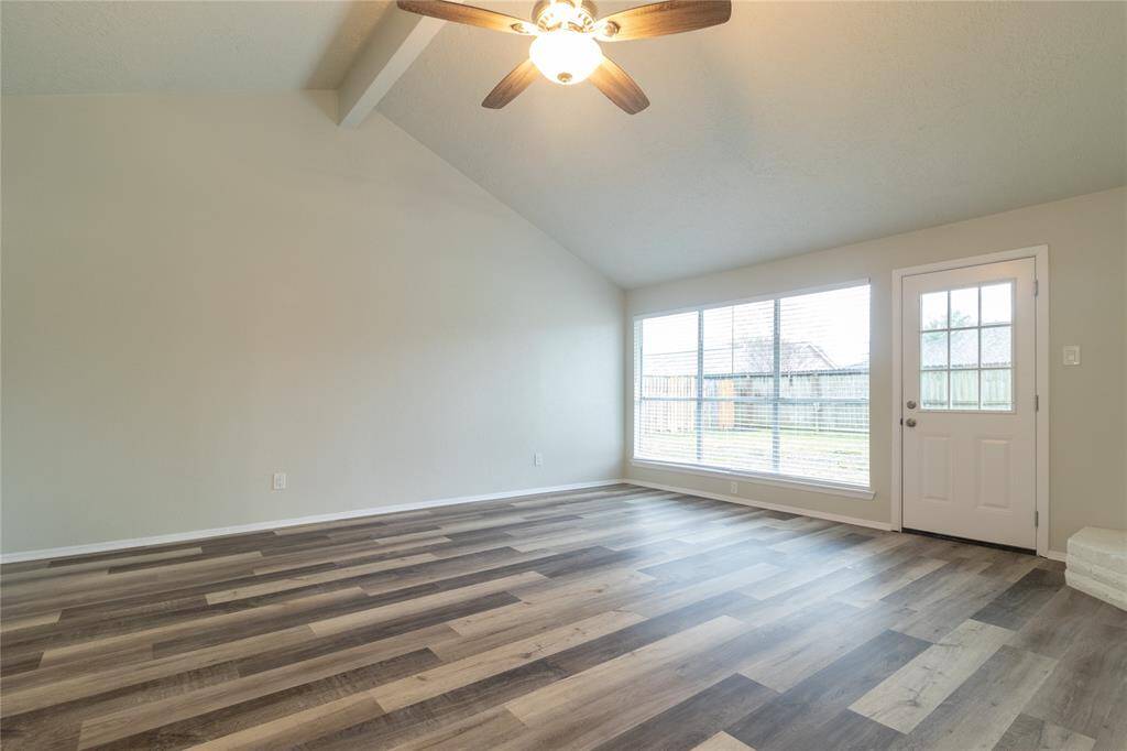 Three large windows in the living room to let in the natural sunlight into the living room.