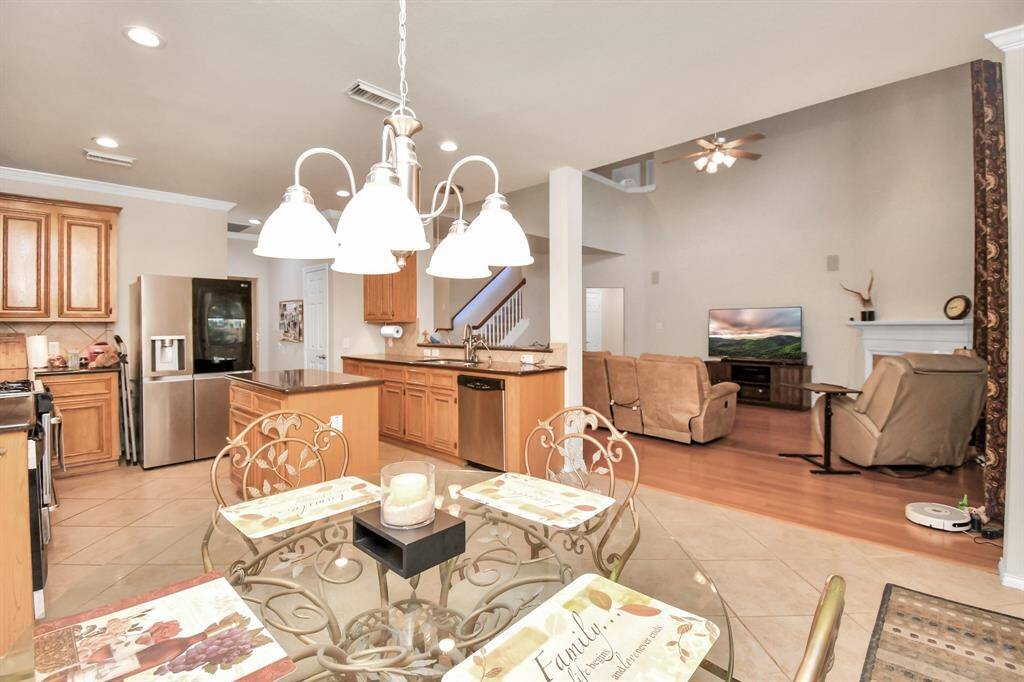 Breakfast area and kitchen open to living room.