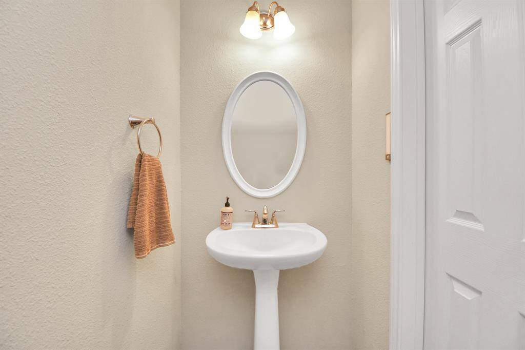 Half bath down stairs next to living room.