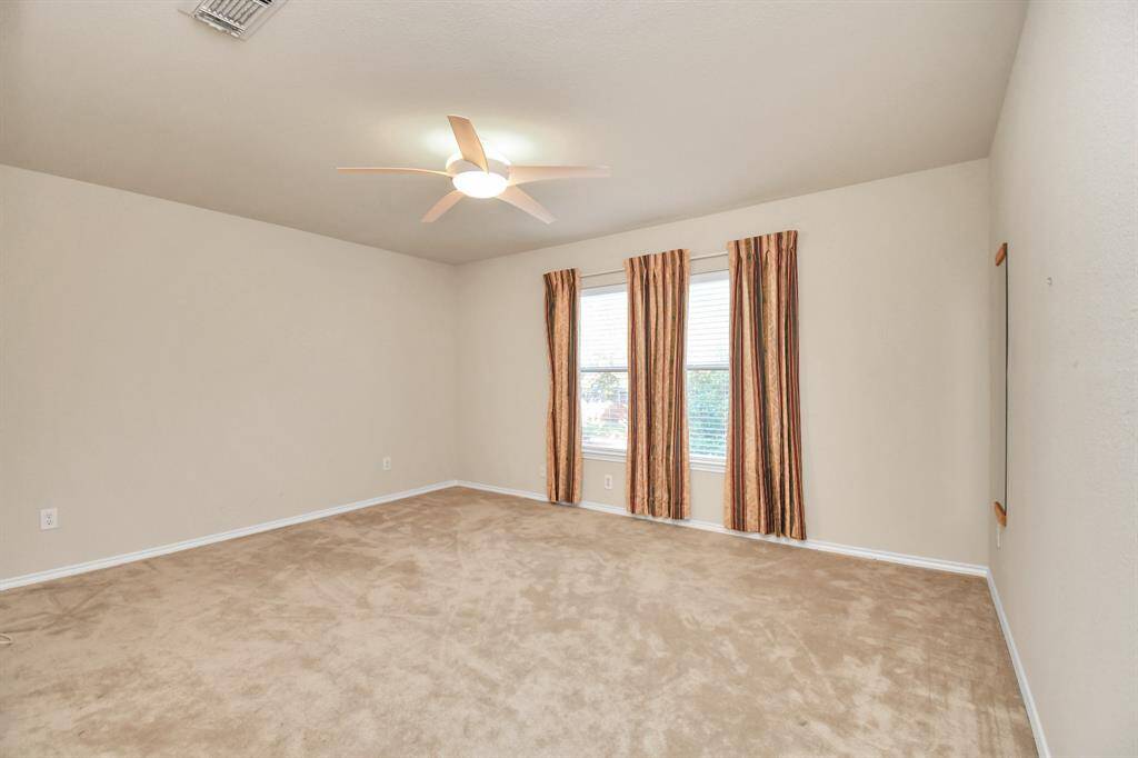 large bedroom upstairs with large walk-in closet