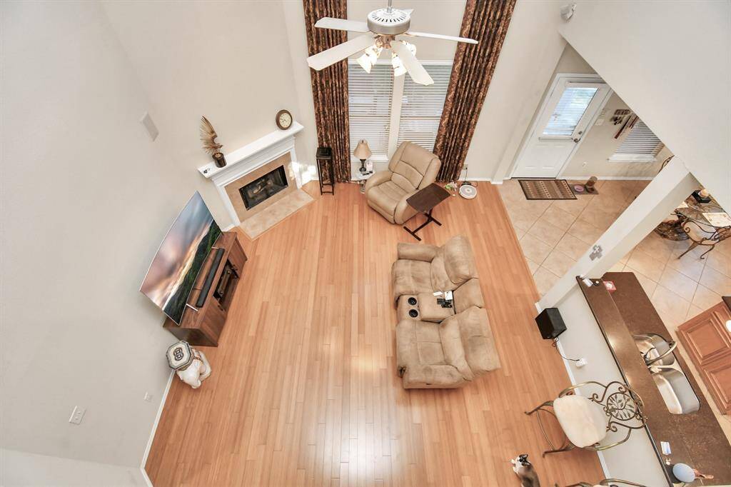 View of living room from 2nd story walk-way.