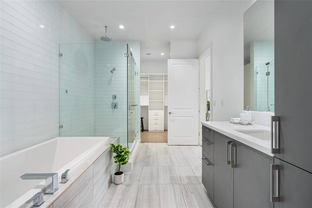 Why go to the spa when you have a bathroom like this??? Elegant tile compliments quartz counters, and modernized cabinetry
